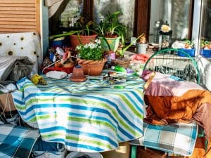 Cluttered outdoor area showing signs of squalor, illustrating observable types of hoarding.